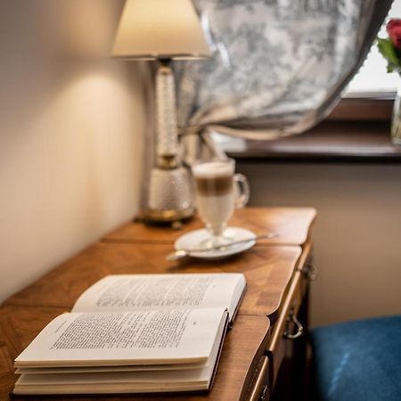 Hotel Grodek Krakow Bagian luar foto A book on a table