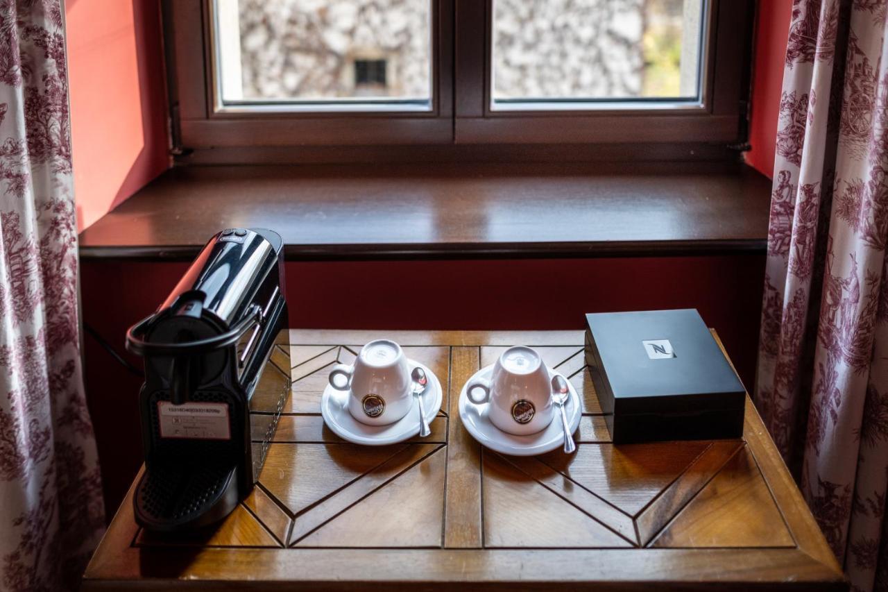 Hotel Grodek Krakow Bagian luar foto A Nespresso machine in a hotel room