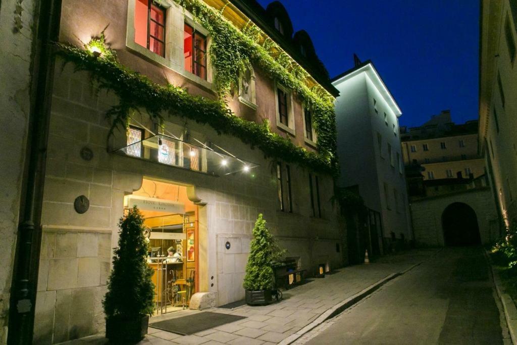 Hotel Grodek Krakow Bagian luar foto The entrance to the restaurant
